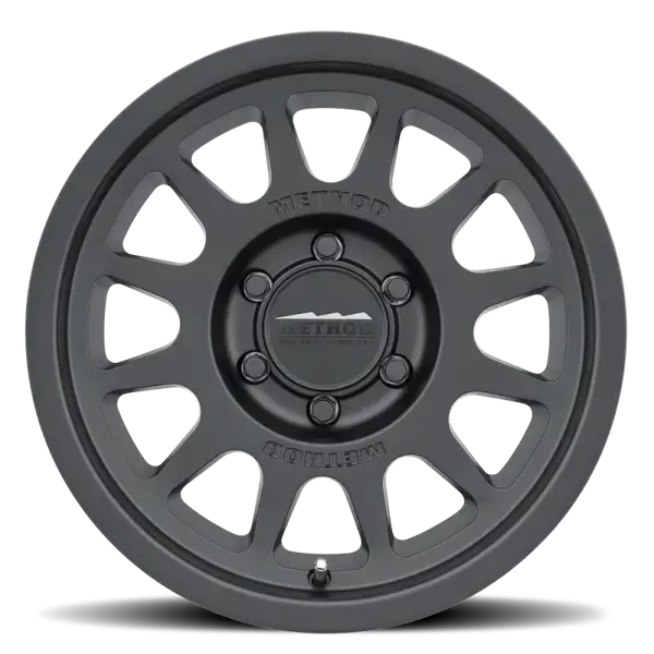 Method MR703 17x8.5 +25mm Offset 6x135 87mm CB Matte Black Wheel